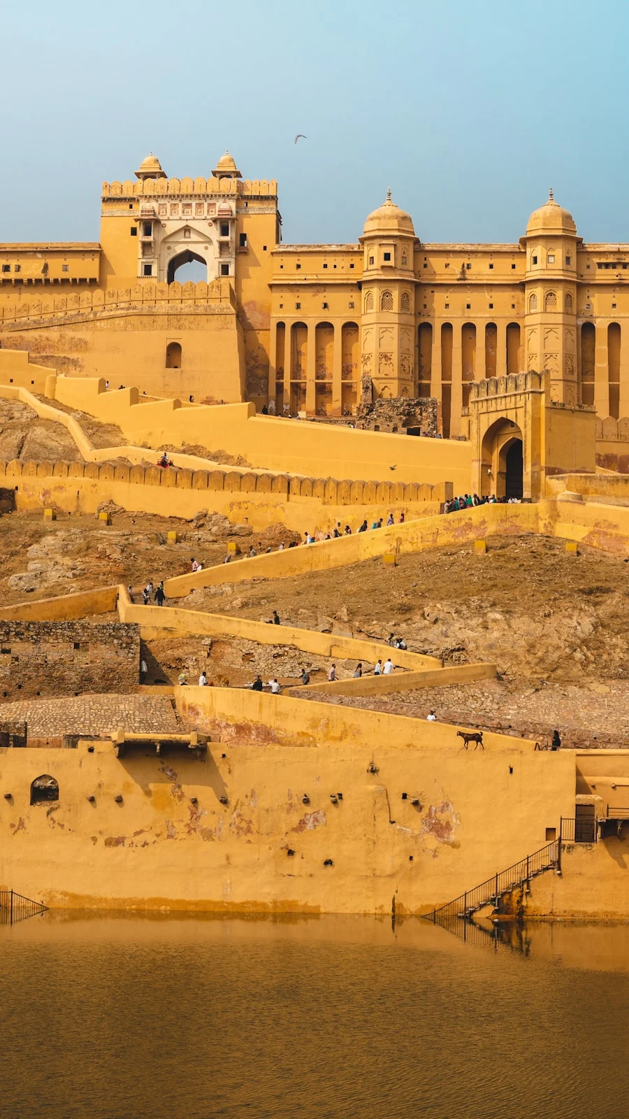 Sandstone Jaisalmer Fort rising from Thar Desert at dusk — Rajasthan tour package